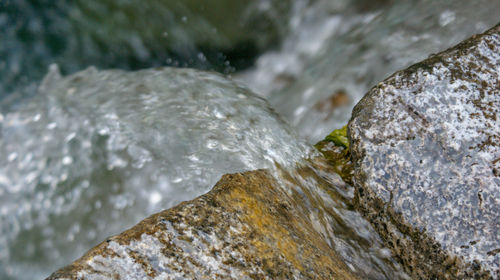 Close-up of water flowing through rocks