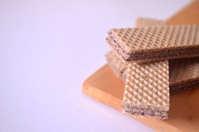 Close-up of stuffed toy on table against white background