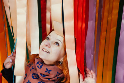 Smiling woman with ribbons