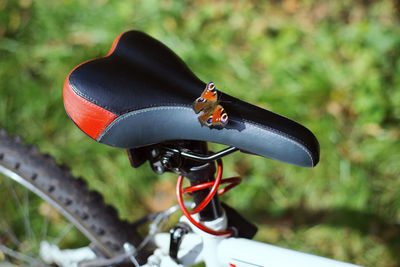 Close-up of butterfly on bicycle