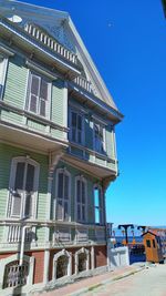 Low angle view of building against blue sky