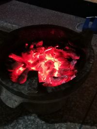 High angle view of fire on barbecue grill