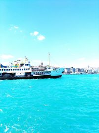 Sailboats in sea against blue sky
