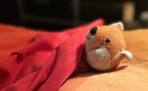 Close-up of stuffed toy on bed