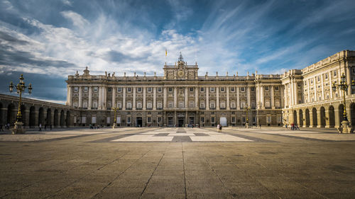 Madrid's royal palace against cloudy sky