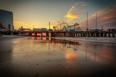 Scenic view of beach against sky during sunset