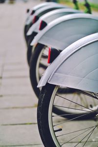 Close-up of bicycles parked on street