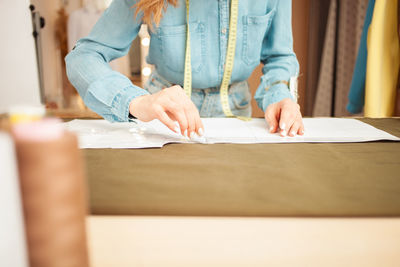 Midsection of man working at home