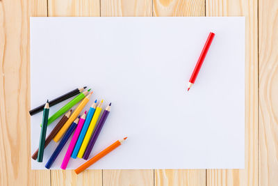 High angle view of colored pencils on table