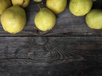 Close-up of pear fruits on wood