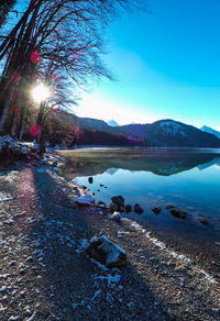 Scenic view of lake against blue sky