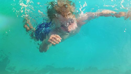 Man swimming in sea