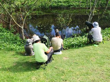 Man sitting on grass in park