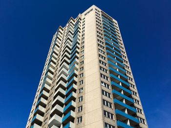 Low angle view of building against clear blue sky