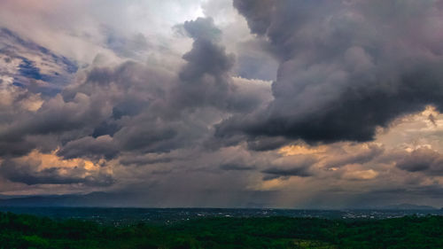 Scenic view of sea against cloudy sky