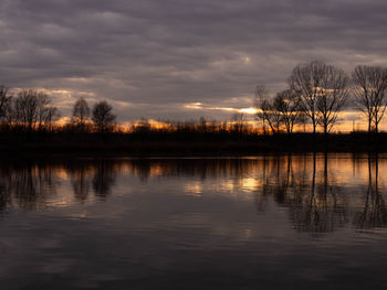 Scenic view of lake against sky during sunset