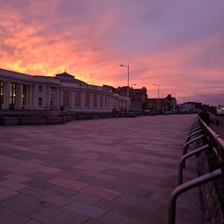 View of buildings against cloudy sky at sunset