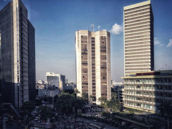 Modern buildings in city against sky