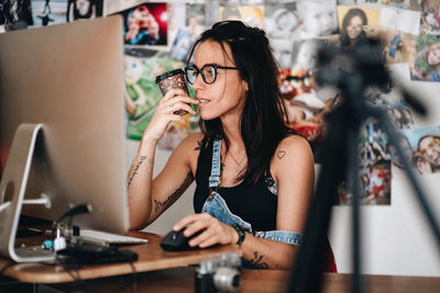 Midsection of woman working on table