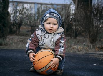 Portrait of a boy holding ball