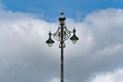 Low angle view of communications tower against sky