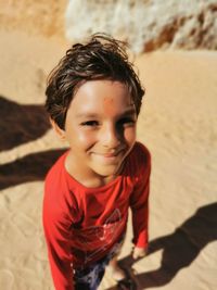 Portrait of boy on sand