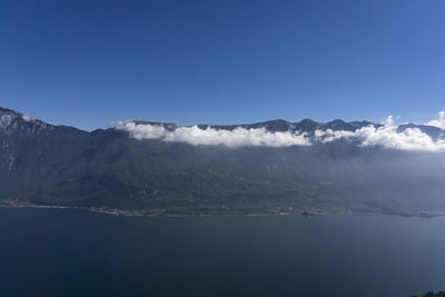 Scenic view of mountains against blue sky