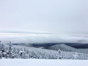 Scenic view of frozen landscape against sky