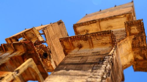 Low angle view of historical building against blue sky