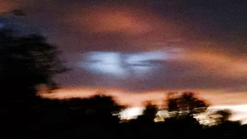 Low angle view of silhouette trees against sky at sunset