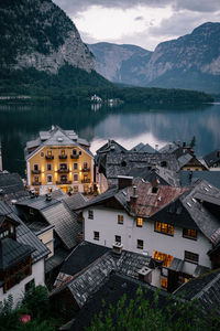 High angle view of houses by lake and buildings