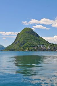Portrait view of the beautiful monte san salvatore and the lake lugano on a sunny day