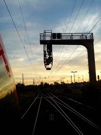 Train on railroad track at sunset