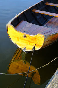 High angle view of yellow boat moored in sea