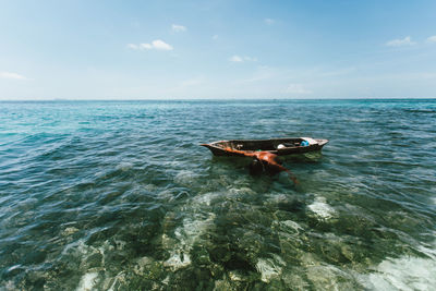 Boat in sea against sky