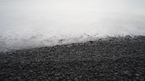 Close-up of pebbles on beach