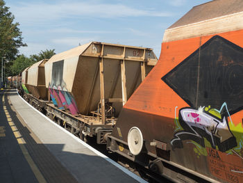 Train on railroad track against sky