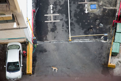 High angle view of parked vehicle against built structure