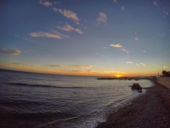 Scenic view of sea at sunset