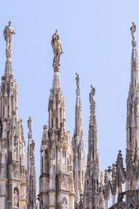 Low angle view of statue of cathedral against clear sky