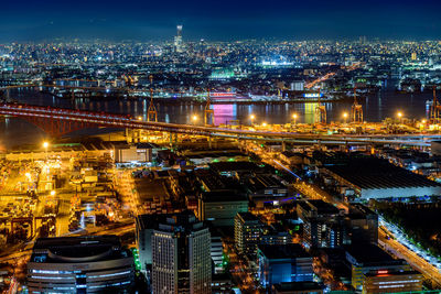 High angle view of illuminated buildings in city at night