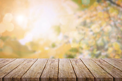 Close-up of wood against sky on sunny day