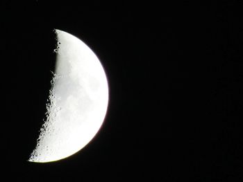 Low angle view of moon against sky at night