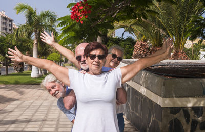 Portrait of smiling senior people standing outdoors