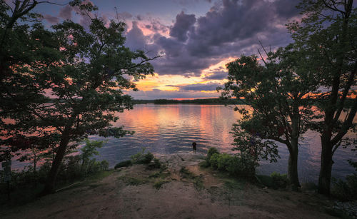 Scenic view of lake against sky during sunset