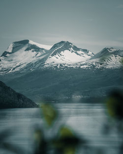 Scenic view of snowcapped mountains against sky