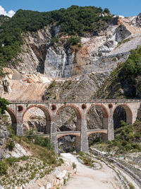 Bridge of vara in carrara, site of the old private marble railway - tuscany, italy.