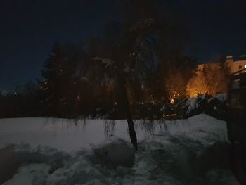 Scenic view of frozen lake against sky at night