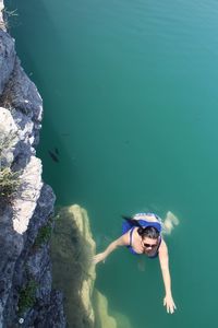 High angle view of woman swimming in sea