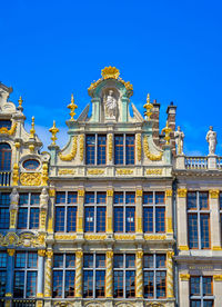 Low angle view of building against blue sky